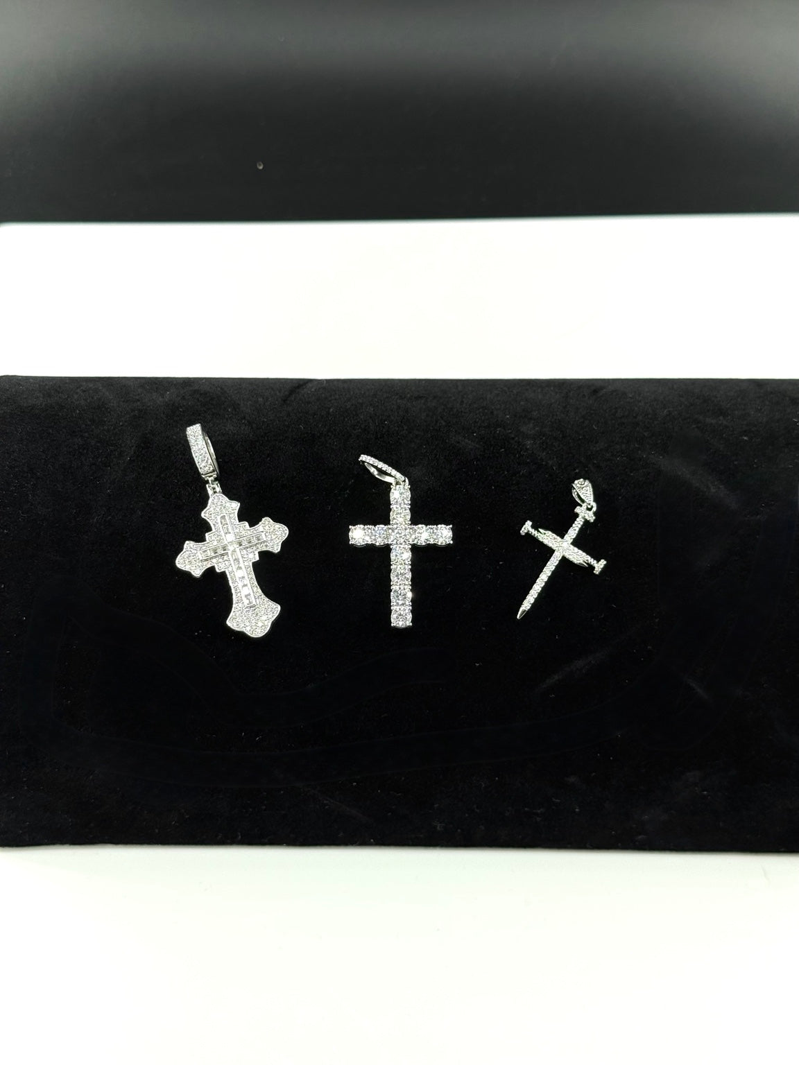 Three 925 sterling silver cross pendants